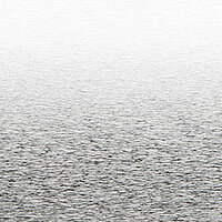 Close-up of a silver venetian blind slat with a brushed and reflective texture