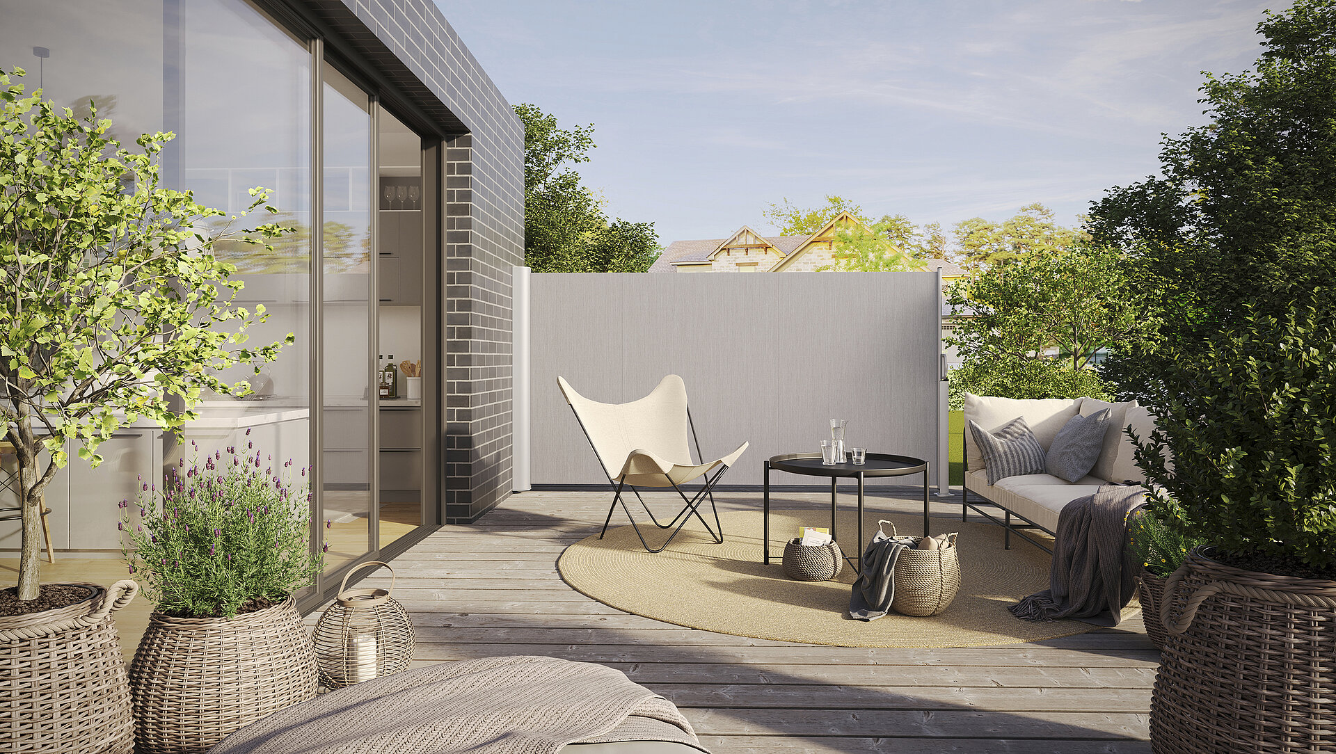 SOLEO II side awning on a terrace offering elegant privacy in a modern garden setting.