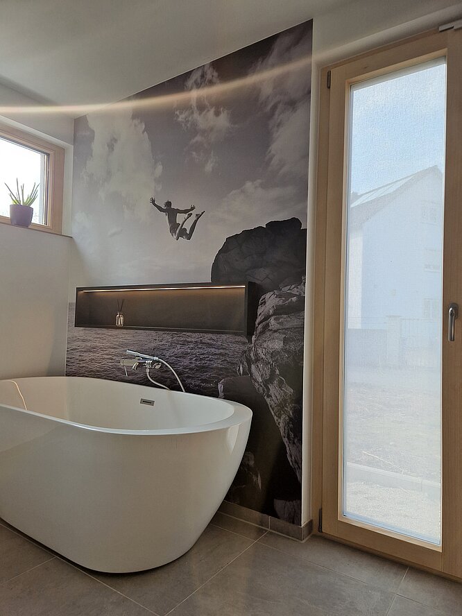 Modern bathroom with Squid textile installed on the window beside a freestanding bathtub.